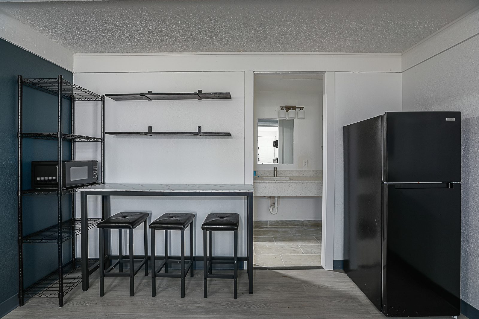 Kitchenette with microwave, refrigerator and breakfast bar