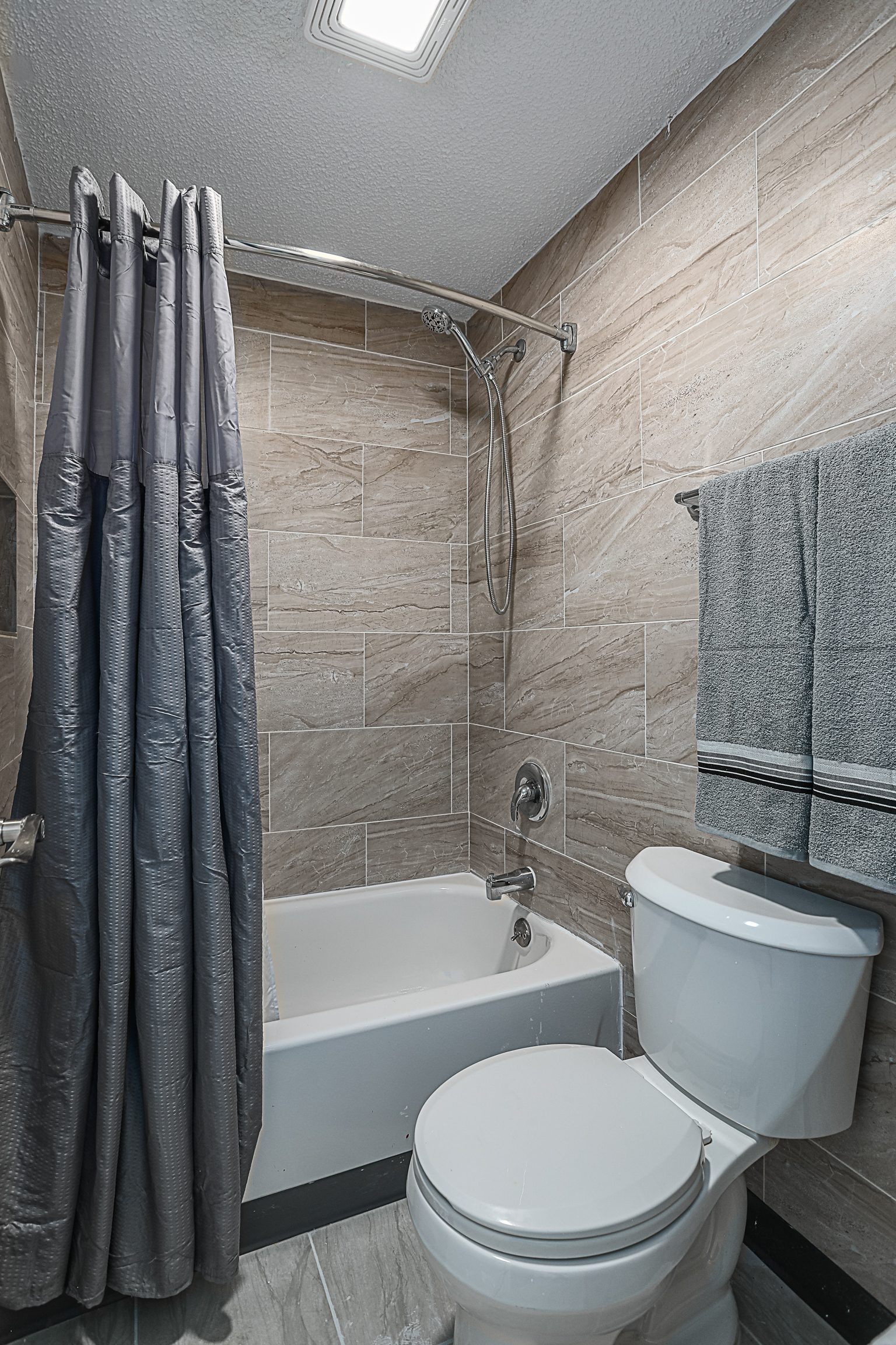 Bathroom with tub and shower