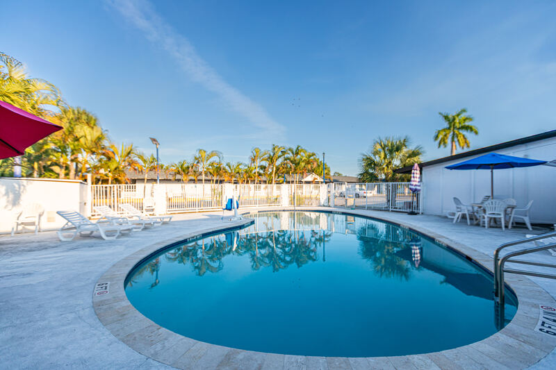 Pool deck with lounge chairs and umbrellas